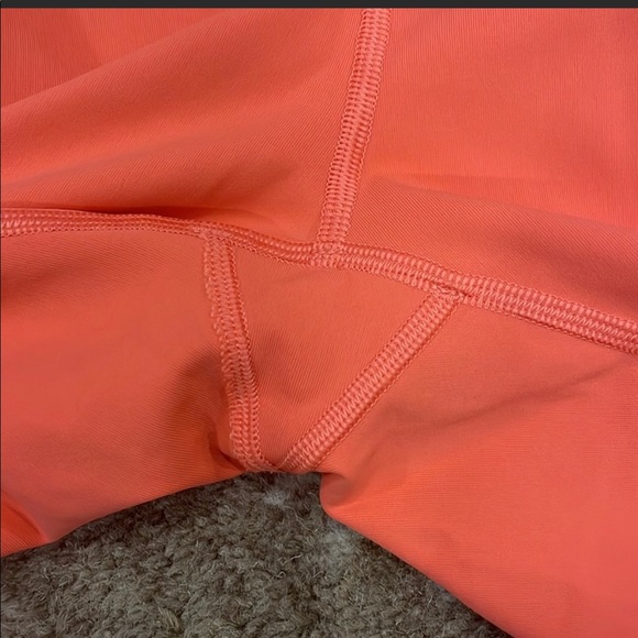 Lululemon Rise and Flow legging in Cape Red coral color with pockets, high rise! - Picture 4 of 9